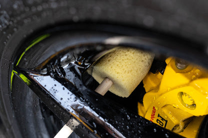 Cleaning a wheel barrel with the Sponge Guru All-Round Wheel Detailer