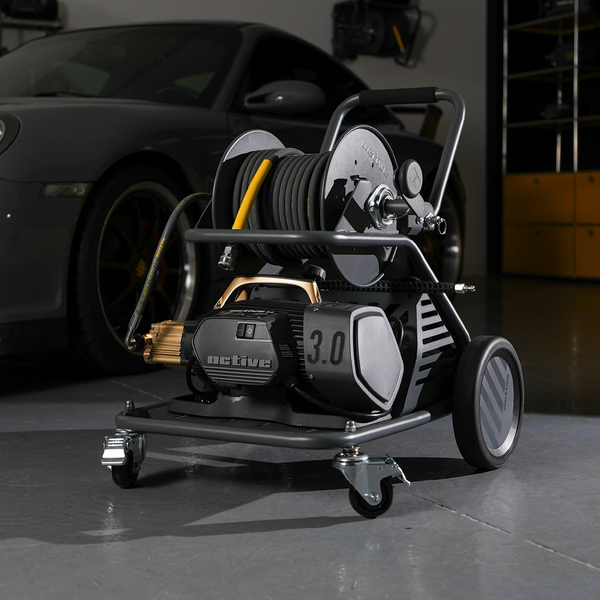 Active Wash Cart & Hose Reel loaded with an Active 3.0 pressure washer in a detailing garage
